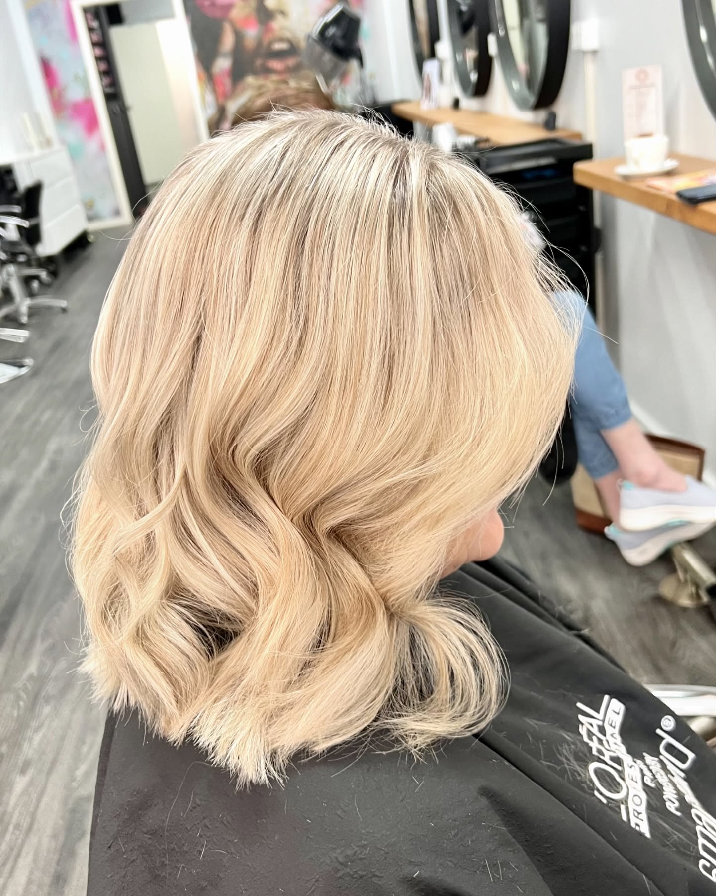 Soft blonde blow wave by Rosewood in Woonona