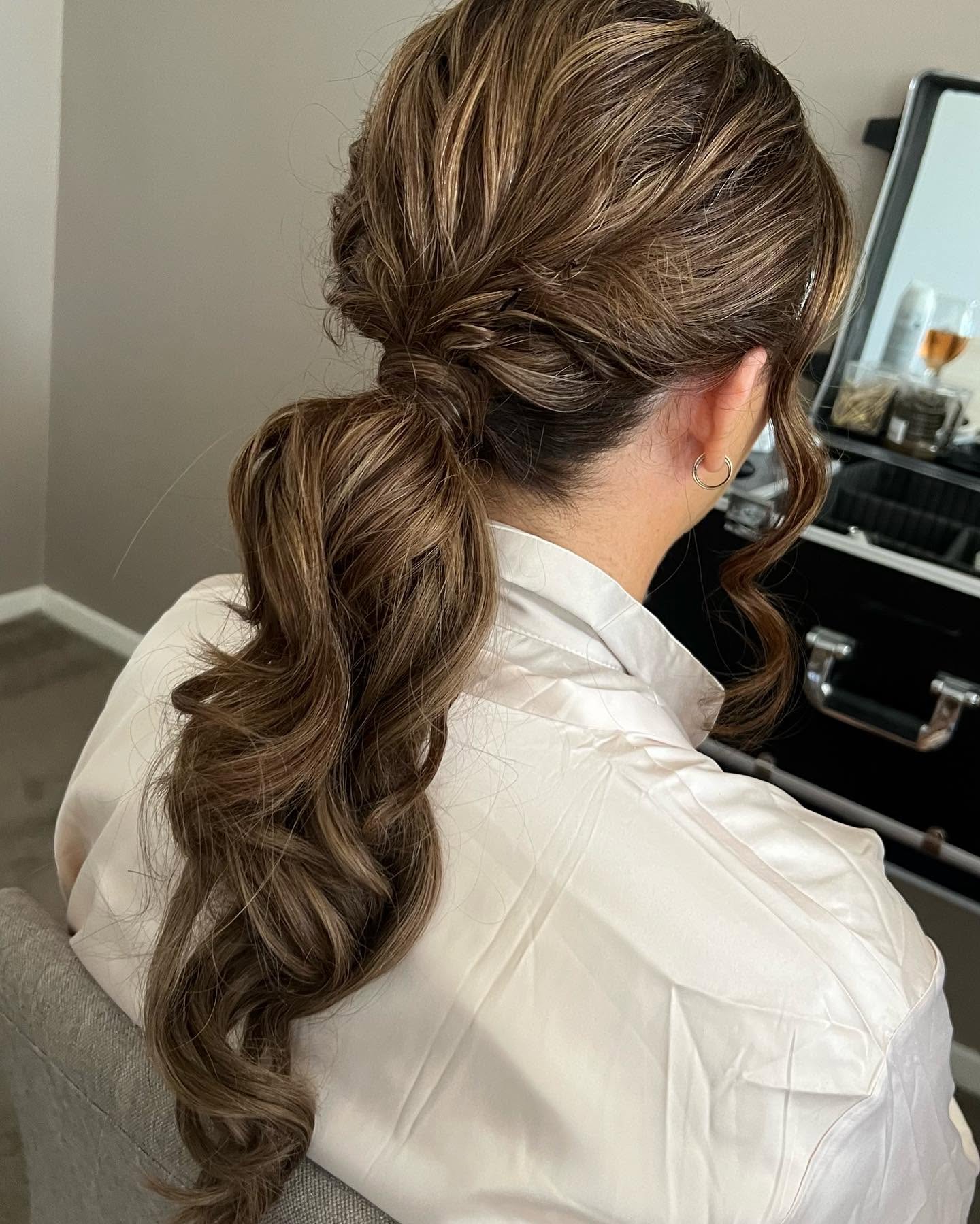 Curled occasion ponytail upstyle by Rosewood in Woonona
