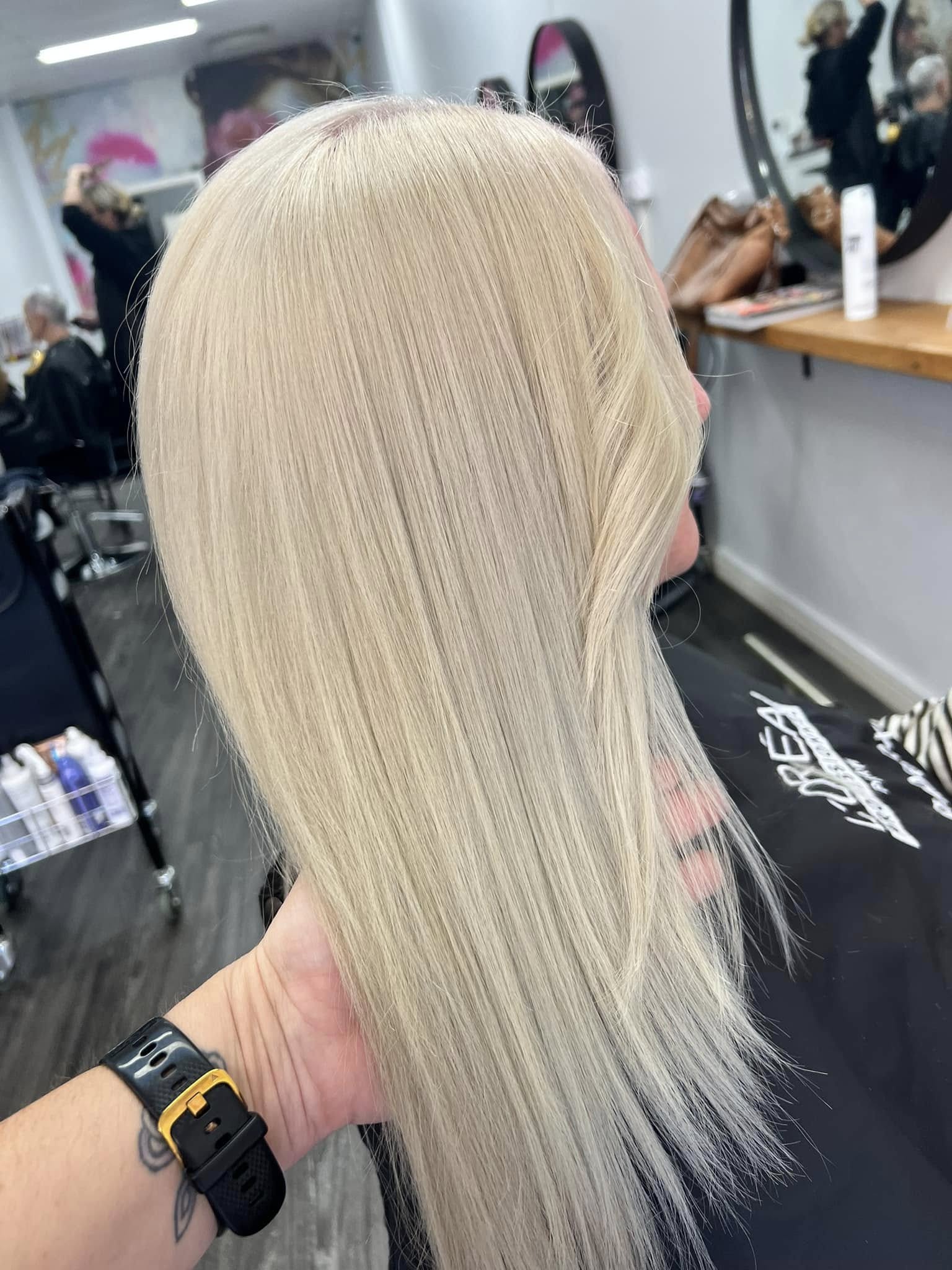 Long, sleek platinum blonde by Rosewood in Woonona