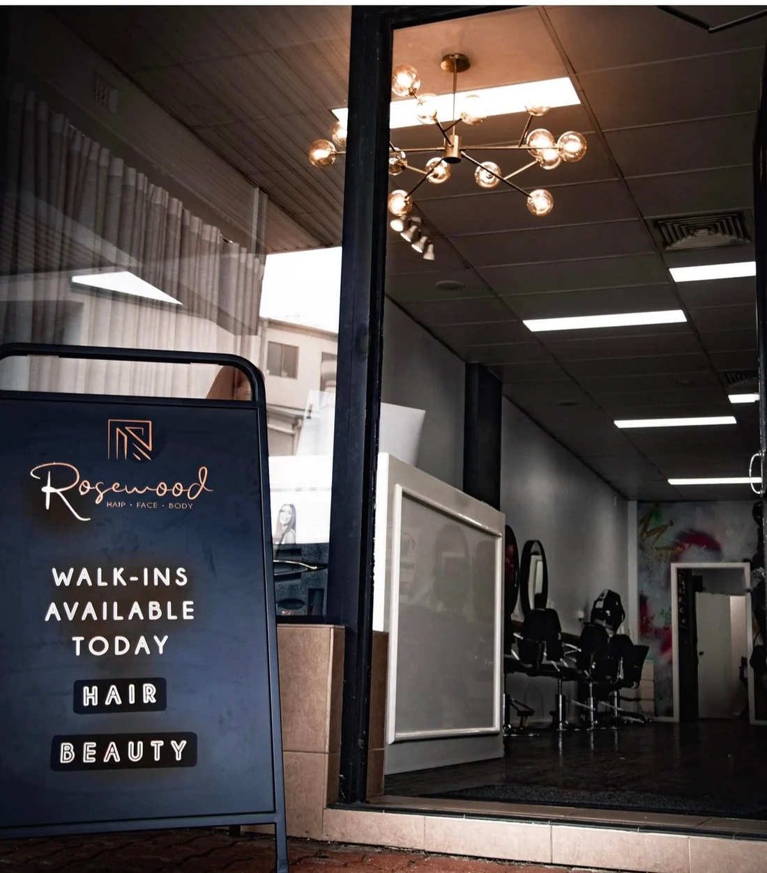 The Rosewood Hair Face Body shopfront on the Princes Highway at Woonona, with the walk-ins sign out the front